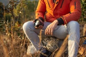 selective focus photography of sitting man holding zoom lens. Calming Activities for ADHD