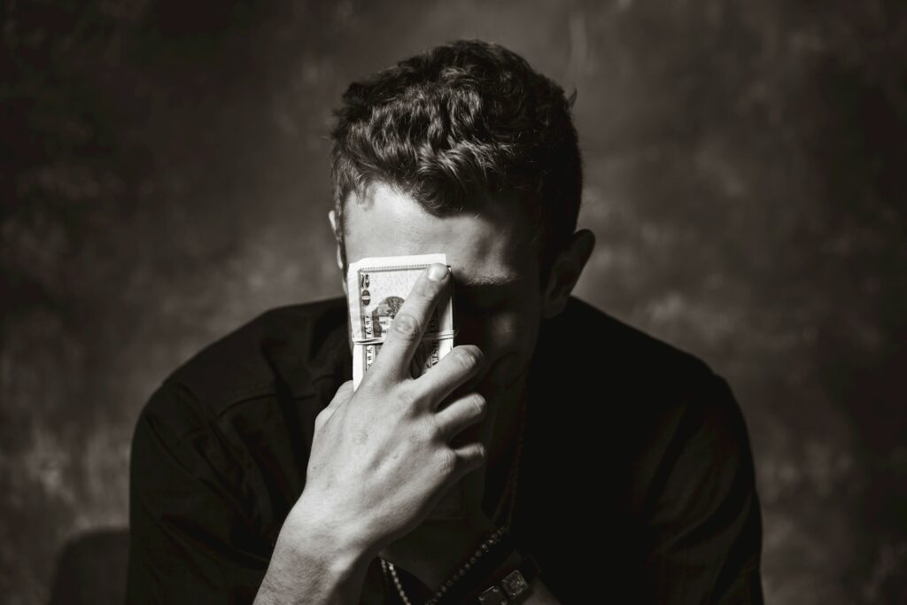 man holding banknote - ADHD Benefits UK