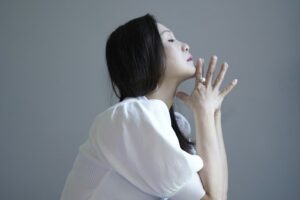 woman in white knit sweater - adhd and menopause