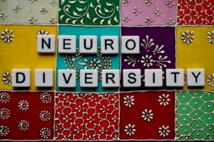 Photo by Peter Burdon - Philanthropeak Coaching - Philanthropeak Coaching the word neuro university spelled with scrabble tiles neurodivergent business coaching